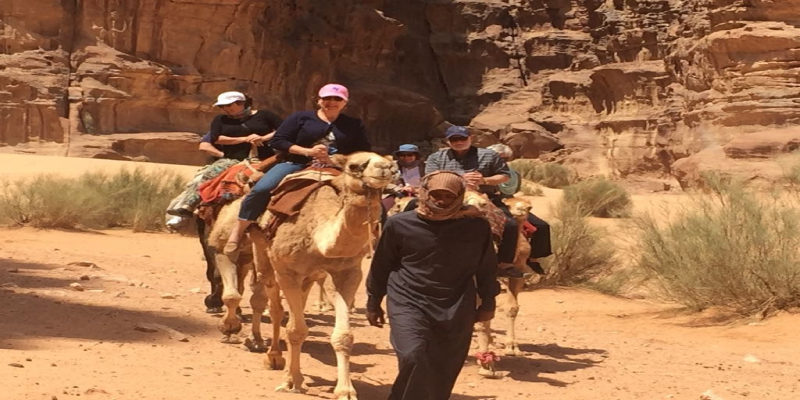 Barbara leading camel carvan in Wadi Rum desert (1)