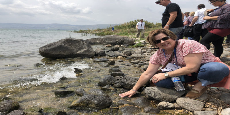 Barbara putting hands in Sea of Gailee (1)